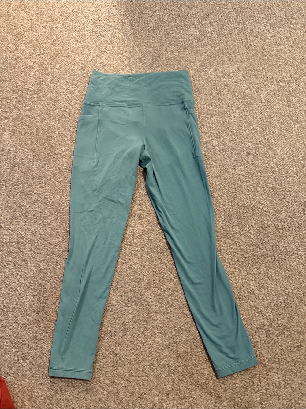 Athleta Teal salutation stash  Leggings with Side Pockets